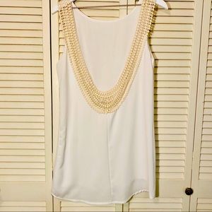 The hanger cream/ white dress.